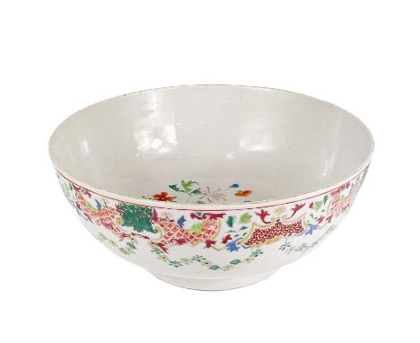 A Chinese famille rose porcelain punch bowl, late 18th/early 19th century. The interior with leafy flowering vines, the exter