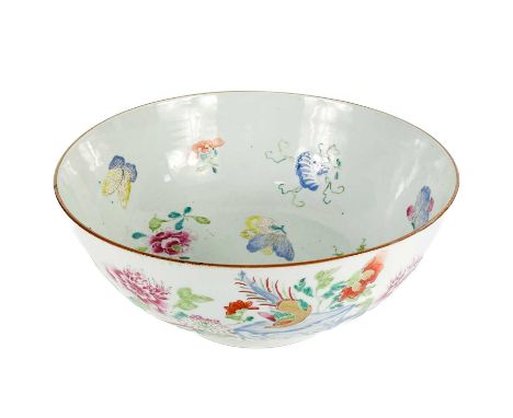 A Chinese famille rose porcelain punch bowl, 18th century. The interior decorated with polychrome painted enamel floral spray