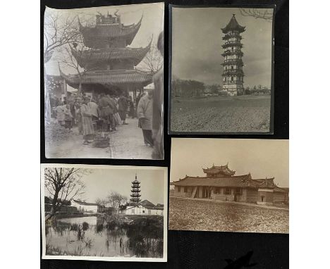 A collection of early 20th century photographs, depicting life in China. Over one hundred b+w photographs, showing temples, p