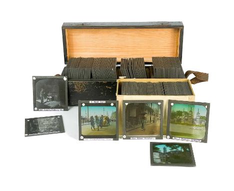China interest. A collection of glass lantern slides. Over one hundred b+w glass slides in two boxes, with descriptions and n