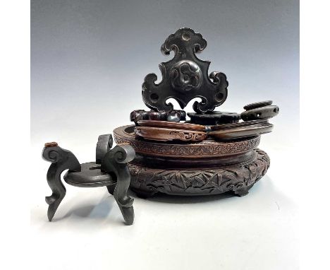 A large Chinese carved hardwood stand, 19th century,.  height 9cm, inner diameter 22.9cm, outer diameter 30cm and seven other