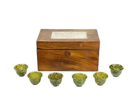 Six Chinese spinach jade bowls. Stored in a 19th century mahogany tea caddy with old paper label inscribed 'Set of six stone 