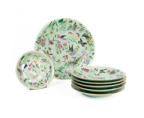 Seven Chinese celadon famille rose plates, 19th century. Each with painted enamel decoration of birds, butterflies and floral