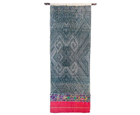 A Laos black and white wall hanging panel, with silk end panel. 63cm x 180cm.