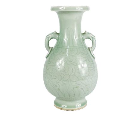 A Chinese celadon glazed porcelain vase. Previously converted to a lamp base, of archaic form with moulded handles and floral