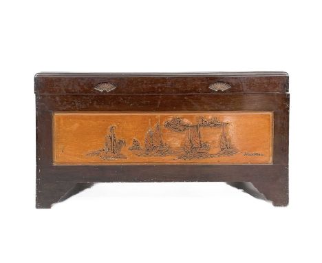 A Chinese camphor wood chest, 20th century. ,The front and top panels carved with boats, height 56cm, width 101cm, depth 50cm