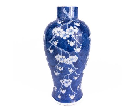 A Chinese prunus pattern blue and white porcelain vase, late 19th century. Four character Kangxi mark, height 31.5cm, width 1