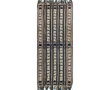 An Ikat textile panel. 159 x 72cm.