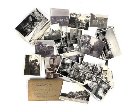A collection of early 20th century photographs, depicting life in China. Eighty-nine b+w photographs in one pack, showing bot