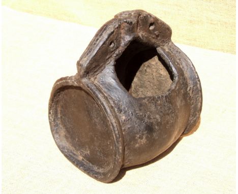 A LEATHER JACK VESSEL. 16th/17th century. Jacks were commonly put to other use as they aged. The cutaway here suggests need f