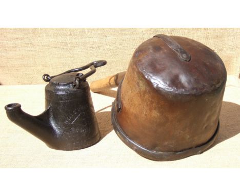 AN IRON POT LAMP AND A DIPPER. Both 19th century. The dipper’s handle has been reduced to create a skillet.  