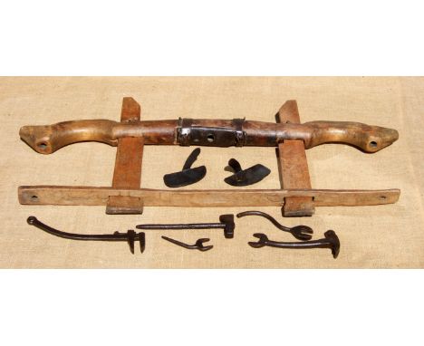 AN EXMOOR CATTLE YOKE, OX CUES AND PLOUGH TOOLS. From a farm near Dunster,19th century. Paired yokes of this type are very sc