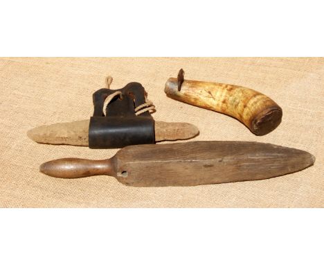 A REAPER’S GRIT HORN, STRICKLE STICK, AND HONE IN LEATHER SLING. All 19th century. A wooden sliding stopper to the horn.
