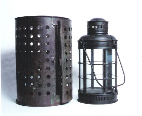 A 100-EYE LANTERN AND A GLAZED CANDLE LANTERN. Both 19th century. 