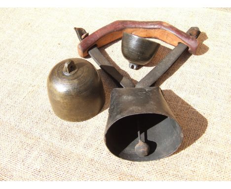 TWO FINE CUP SHEEP BELLS AND A WIDE MOUTH BELL. The cup bells, 18th century. The larger marked ‘RW’ is probably from Robert W