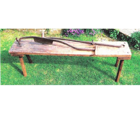 A CLOGGER’S WORK BENCH AND TWO CLOGGING IRONS. From East Anglia, early 20th century.  