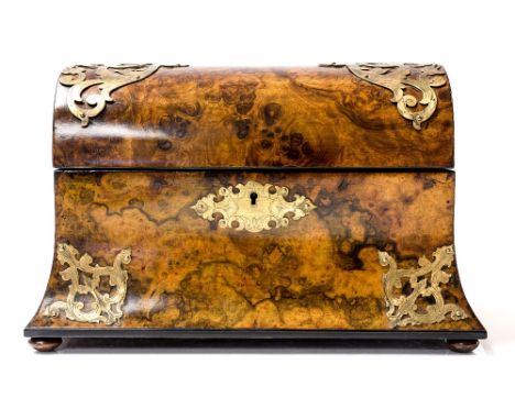 A Victorian figured walnut tea caddy, circa 1860, domed hinged top, pierced brass scroll mounts, triple division satinwood fi