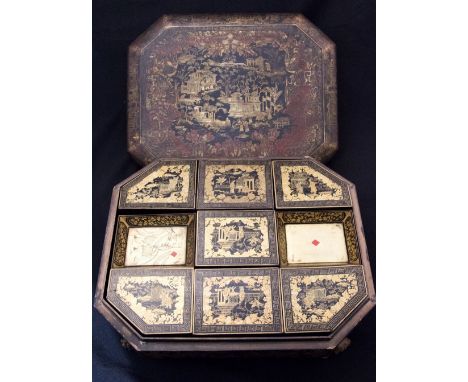 A 19th Century Chinese export black lacquer game compendium, circa 1820, of octagonal sarcophagus form, extensively decorate 