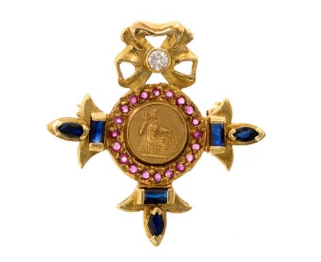 An 18ct gold MBE brooch, set diamond to the bow surmount, rubies and sapphires approximately 5.5g

