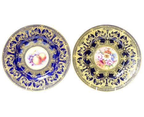 Two Royal Worcester cabinet plates, one decorated with a fruit painted cartouche of grapes and apples by P Platt, the other w