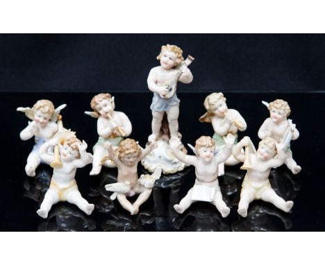 *A Continental porcelain band of angels, each modelled as a putto playing a musical instrument, probably Dresden (9)