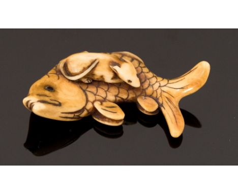 An Oriental ivory netsuke, carved as a rat on a carp, width 5cm (s.d)