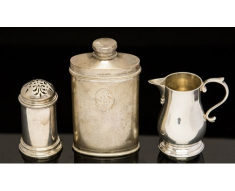 A Tuck Chang Chinese export silver powder flask, a silver Sparrow beak pear shaped cream jug with a scroll handle, maker C.J.