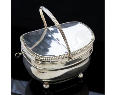 A George III silver tea caddy box, swing handle, hinged double cover, bombe body, ball feet, maker  Rebecca & William Emes, L
