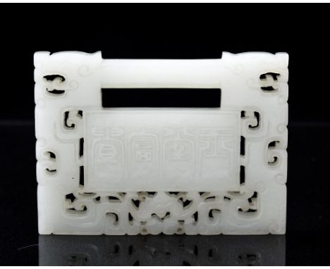 A Chinese carved jade lock pendant buckle, reticulated, rectangular plaque form, the central cartouche carved with peony on a