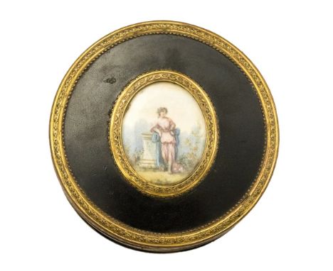 *A 19th Century mourning circular tortoiseshell lidded box, gilt metal mounts, the pull off cover inset with an oval portrait