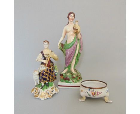*A Staffordshire square based figure, circa 1820, along with a Bilston enamel salt, circa 1770 (2)

Condition: Staffordshire 