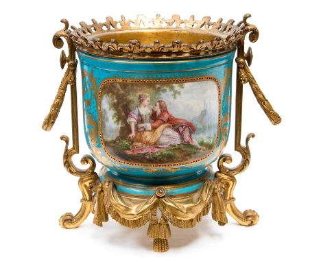 *A 19th century Sevres ormolu mounted jardiniere, turquoise ground painted with a cartouche of amorous lovers in a Romantic l
