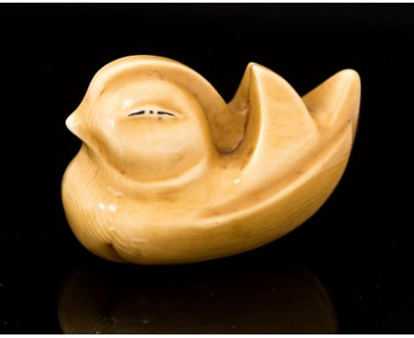 An Oriental ivory netsuke, carved as a stylized duck, signed, width 4cm