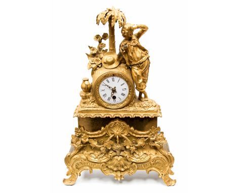 A 19th Century French ormolu and brass bracket timepiece, circa 1870, surmounted with a figure of Robinson Crusoe sheltering 