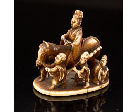 An Oriental ivory netsuke, carved as a regal figure on horseback in procession, width 4.5cm (s.d)