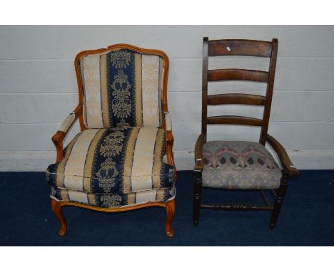 A REPRODUCTIN FRENCH STYLE ARMCHAIR, covered in striped upholstery (this chair does not comply with the furniture and furnish