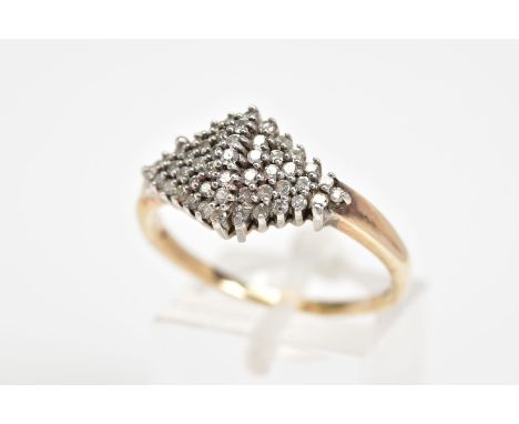 A 9CT GOLD DIAMOND RING, designed as a lozenge shaped cluster, to a plain polished band, with a 9ct hallmark for London, stam