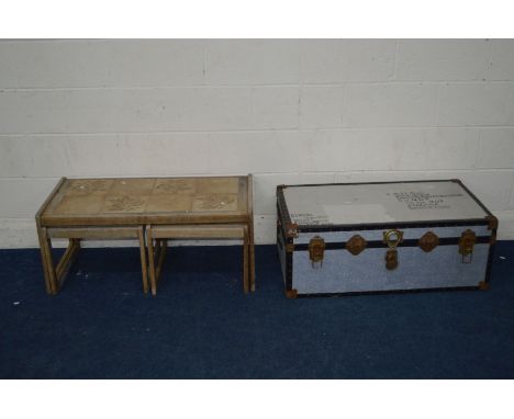 A VINTAGE TRAVELLING TRUNK, a tile topped nest of three tables and three sieves
