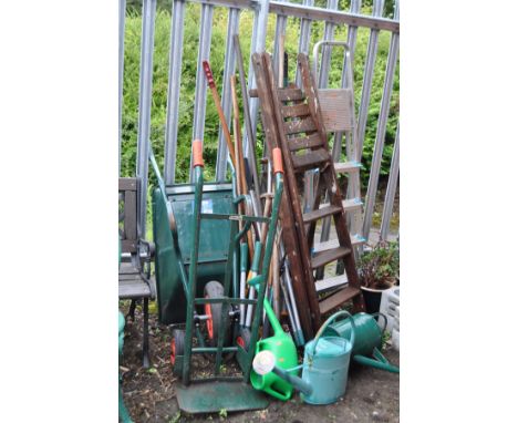 A JEWSON METAL WHEEL BARROW, two step ladders, a sack truck and a quantity of garden tools (15+)