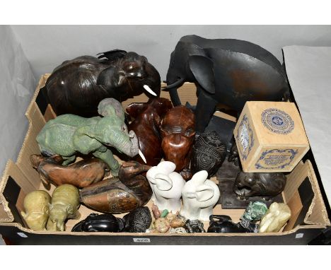 A BOX OF TREEN, STONE, METAL AND RESIN ELEPHANT FIGURES, including a leather covered figure, a porcelain elephant tea caddy a