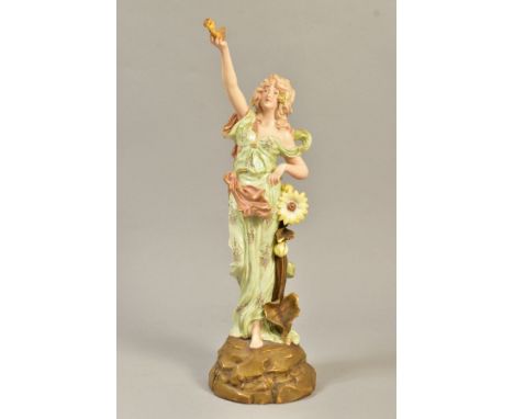 E.W.TURN, WIEN, AUSTRIAN PORCELAIN FIGURE, depicting woman holding lantern/lamp with fire coming out, standing next to sunflo