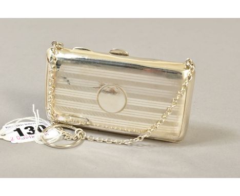 A GEORGE V SILVER PURSE, horizontal engine turned stripe decoration, leather lined interior, on chain with finger ring, maker