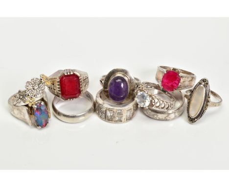 A SELECTION OF RINGS, to include an oval opal doublet ring, an oval amethyst set ring, etc, most with marks to indicate silve