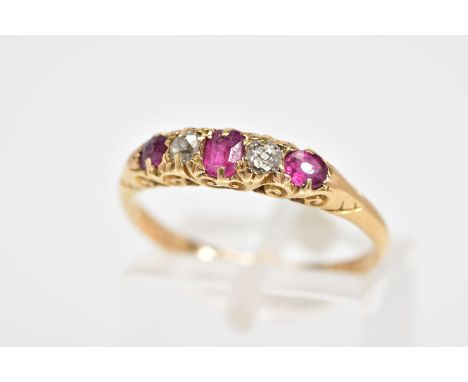 AN EARLY 20TH CENTURY RUBY AND DIAMOND BOAT RING, designed with a row of graduated oval cut rubies interspaced with two old c