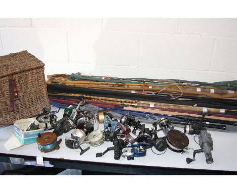 A COLLECTION OF VINTAGE FISHING EQUIPMENT, to include split cane rods and others, fishing reels including Elo, A&amp;W McCart