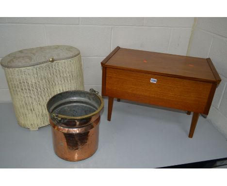 AN ARNOLD TEAK SEWING BOX on shaped legs with sewing contents, together with a copper bucket, a Lloyd Loom kidney linen baske