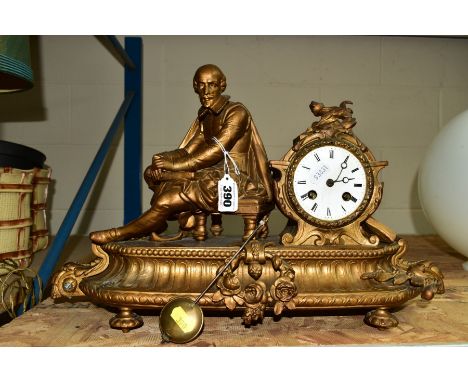 A LATE 19TH CENTURY GILT METAL MANTEL CLOCK, figural mount of Shakespeare, enamel dial, Roman numerals, eight day movement, b