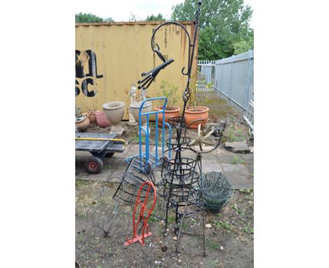 A QUANTITY OF WROUGHT IRON PLANTERS including a globe sundial, a three tiered planter, various hanging baskets, plant pot hol