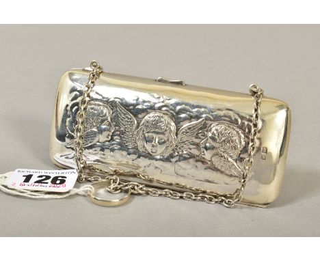 AN EDWARDIAN SILVER PURSE, embossed with Reynold's Angels decoration, tan leather lined interior, on chain with finger ring, 