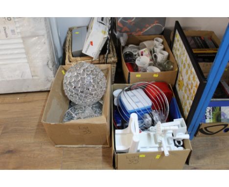 An ironing board, a Pikachu picture and wicker baskets and three boxes of kitchenware, light fittings etc  